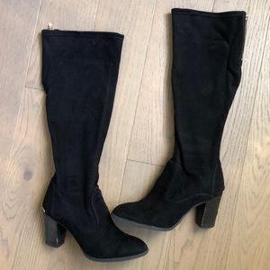 Black Marc Fisher knee high boots.